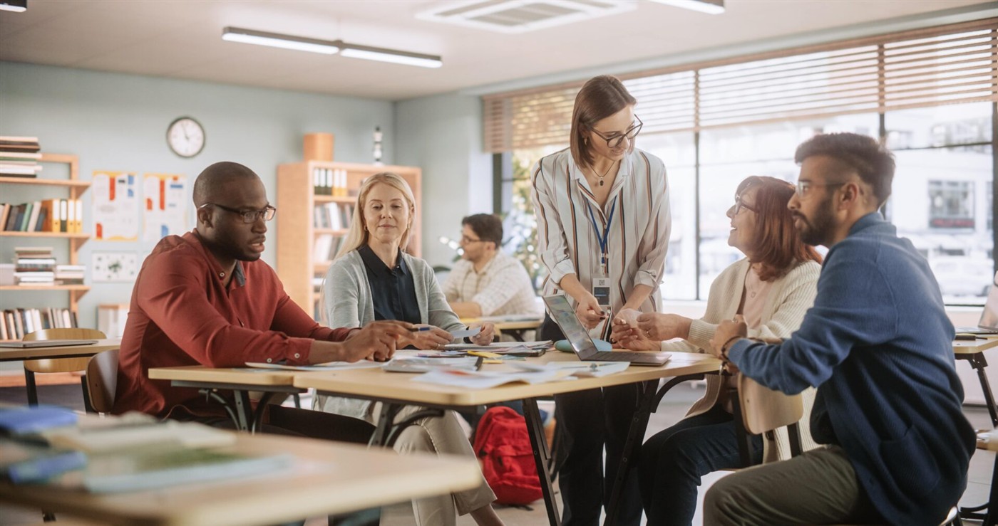 Teachers collaborating on AI integration